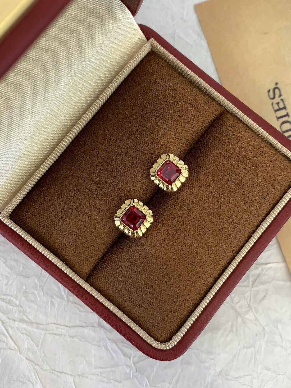 All Eyes Up Here Cushion Cut Red Stone Studs